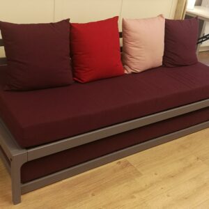 Plum trundle bed on display in store